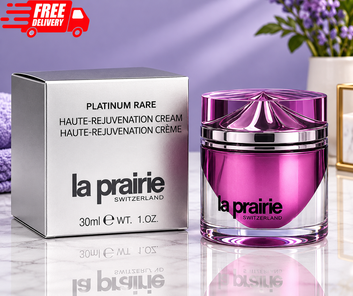 : A La Prairie Platinum Rare Haute-Rejuvenation Cream box and matching purple metallic jar displayed on a reflective surface against a purple background, with a “FREE DELIVERY” graphic in the upper-left corner.